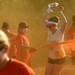 A runner is sprayed with orange powder in the Ypsilanti Color Run 5K on Sunday morning. Melanie Maxwell I AnnArbor.com